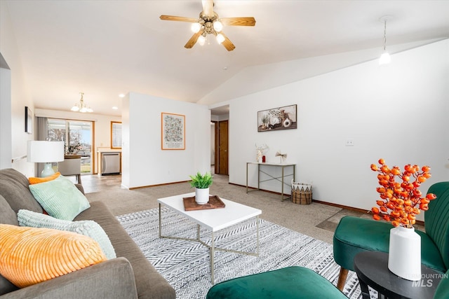 living area featuring baseboards, vaulted ceiling, carpet flooring, and ceiling fan with notable chandelier