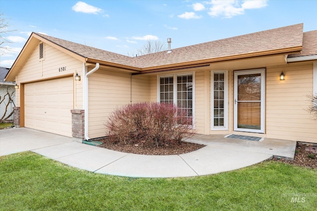 exterior space with a garage, roof with shingles, and driveway