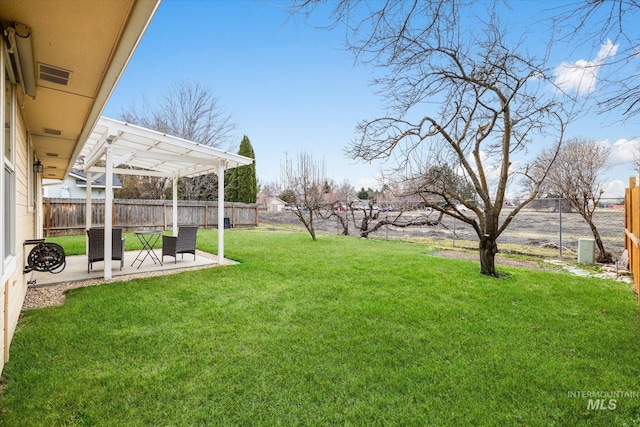 view of yard with a patio, a fenced backyard, visible vents, and a pergola