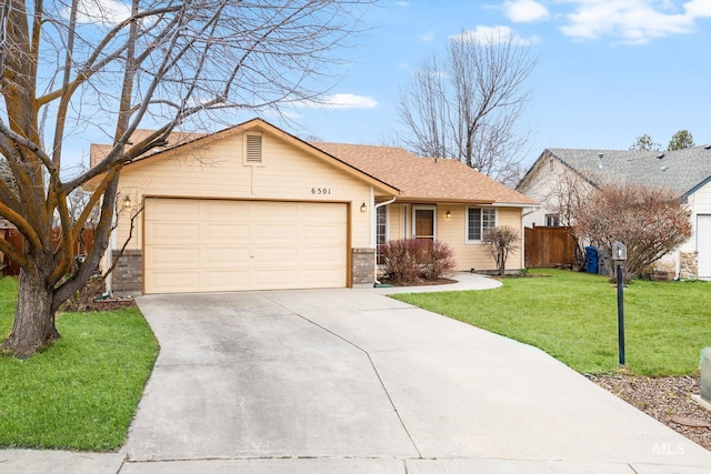 ranch-style home with a garage, brick siding, fence, driveway, and a front yard