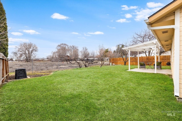 view of yard featuring a patio area and a fenced backyard