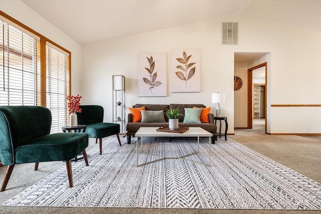 living room featuring lofted ceiling, baseboards, visible vents, and light colored carpet