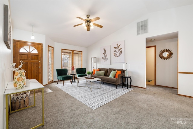 living area featuring carpet floors, ceiling fan, visible vents, and baseboards