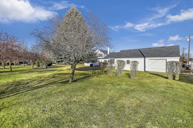 view of yard with a garage