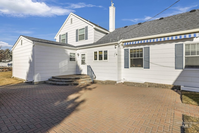 back of property with a patio area