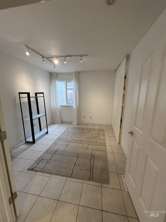 spare room with light tile patterned flooring