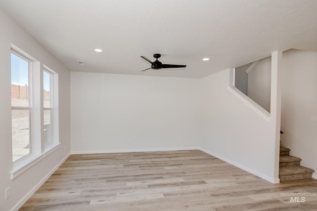 empty room with light hardwood / wood-style flooring and ceiling fan