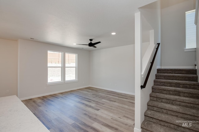 interior space with ceiling fan and hardwood / wood-style floors