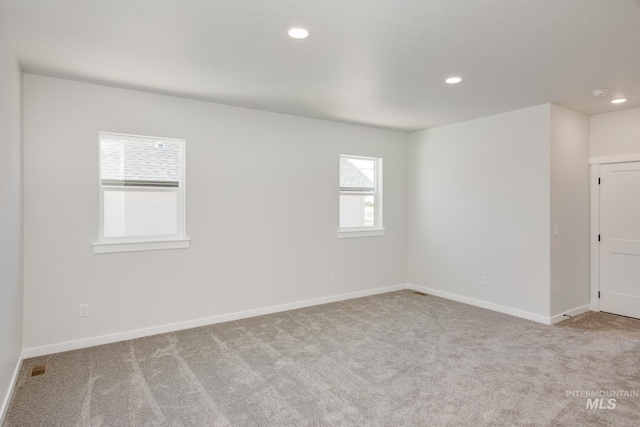 view of carpeted spare room