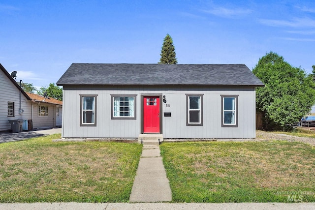 155 N N 11th E, St, Mountain Home, ID 83647 - view of front of house featuring roof with shingles and a front lawn