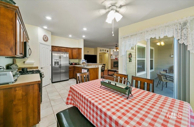 1207 Empire Ct, Caldwell, ID 83607 - dining area featuring a ceiling fan, light tile patterned flooring, and recessed lighting