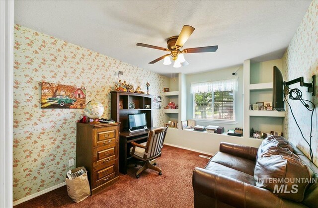 1207 Empire Ct, Caldwell, ID 83607 - home office featuring ceiling fan, wallpapered walls, dark carpet, and baseboards