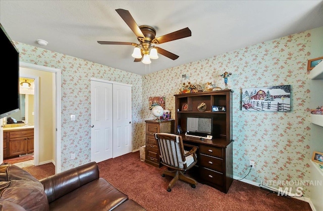 1207 Empire Ct, Caldwell, ID 83607 - office with a ceiling fan, dark colored carpet, and wallpapered walls