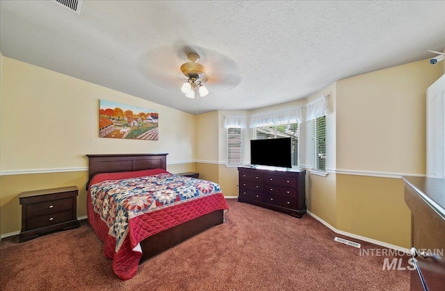 1207 Empire Ct, Caldwell, ID 83607 - carpeted bedroom with baseboards, a ceiling fan, and a textured ceiling
