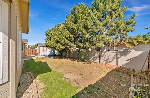 1207 Empire Ct, Caldwell, ID 83607 - view of yard featuring a shed and an outbuilding