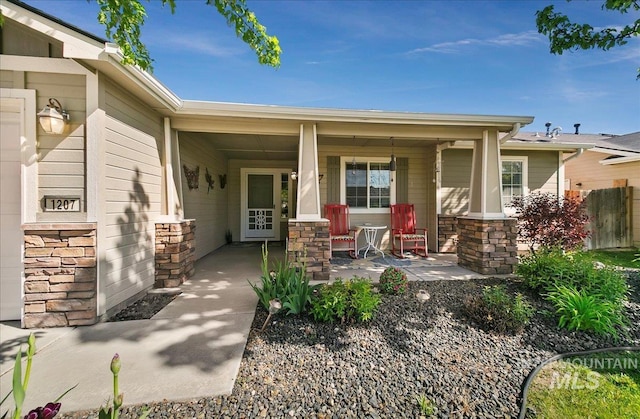 1207 Empire Ct, Caldwell, ID 83607 - entrance to property with a porch and stone siding