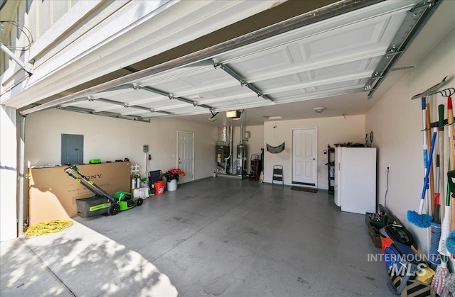 1207 Empire Ct, Caldwell, ID 83607 - garage with a garage door opener, gas water heater, and electric panel