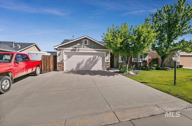1207 Empire Ct, Caldwell, ID 83607 - view of front of home with a garage, board and batten siding, stone siding, and concrete driveway