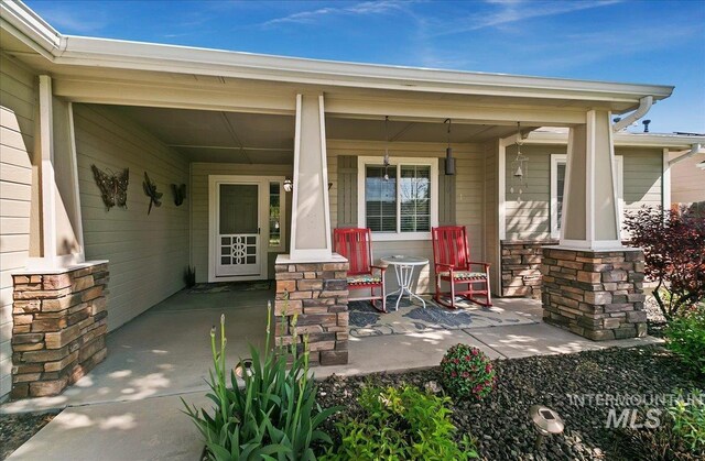 1207 Empire Ct, Caldwell, ID 83607 - entrance to property featuring a porch and stone siding