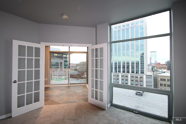 entryway featuring carpet flooring and french doors