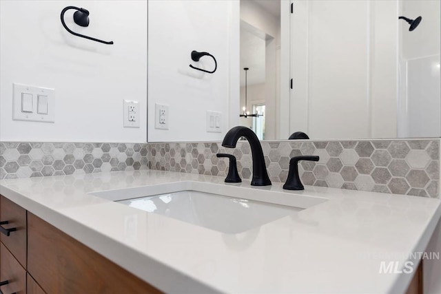 interior details with vanity and backsplash