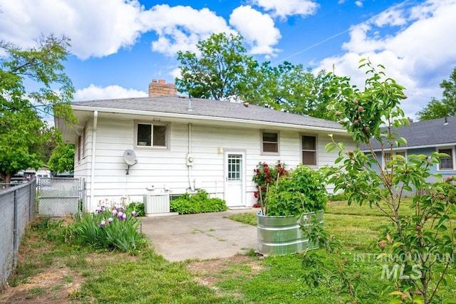 1114 12th Ave, Lewiston, ID 83501 - rear view of property featuring a patio area and a chimney