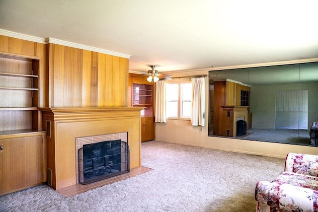 1114 12th Ave, Lewiston, ID 83501 - living room featuring a fireplace with flush hearth, ornamental molding, a ceiling fan, and carpet