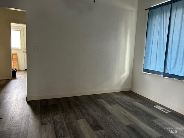 1703 7th Ave, Lewiston, ID 83501 - empty room with dark wood-type flooring