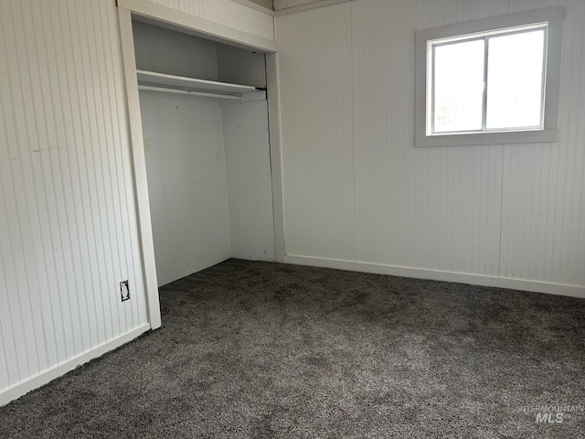 1703 7th Ave, Lewiston, ID 83501 - unfurnished bedroom with dark carpet and a closet