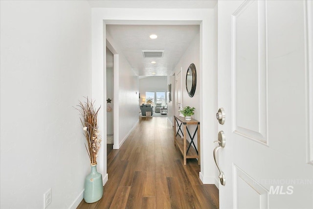 corridor with dark hardwood / wood-style floors