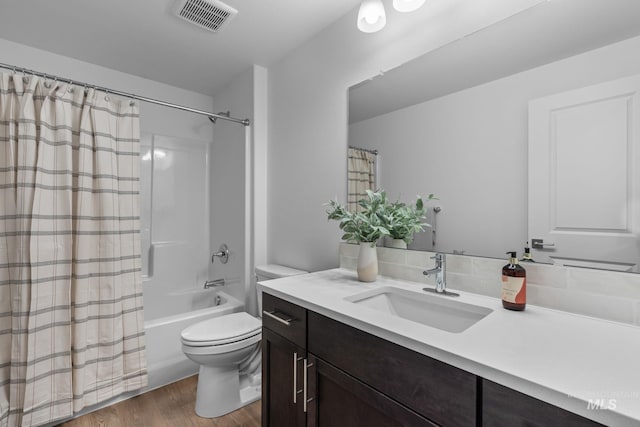 11287 Shadow Glen Dr, Caldwell, ID 83605 - full bathroom featuring vanity, wood finished floors, and shower / bath combo