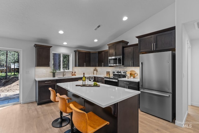 11287 Shadow Glen Dr, Caldwell, ID 83605 - kitchen with stainless steel appliances, backsplash, light countertops, recessed lighting, and lofted ceiling