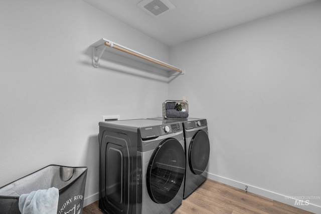 11287 Shadow Glen Dr, Caldwell, ID 83605 - washroom featuring independent washer and dryer and wood finished floors