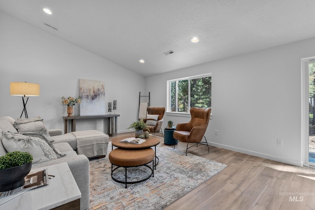11287 Shadow Glen Dr, Caldwell, ID 83605 - living room with light wood-style flooring, healthy amount of natural light, recessed lighting, and vaulted ceiling
