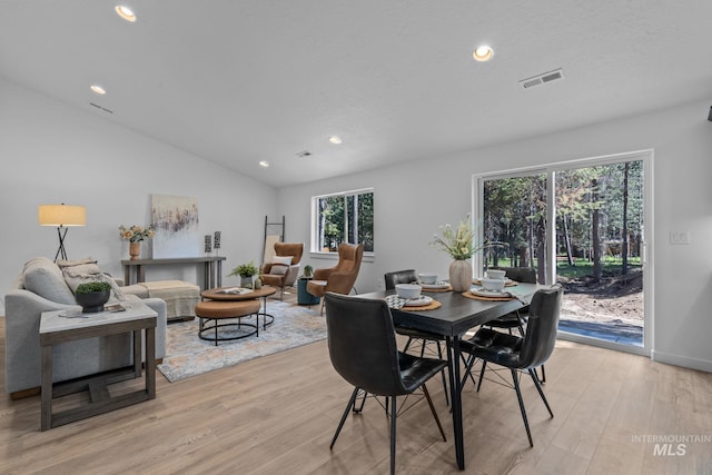 11287 Shadow Glen Dr, Caldwell, ID 83605 - dining room featuring light wood finished floors, recessed lighting, and vaulted ceiling
