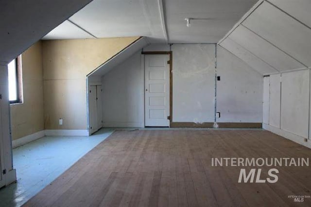 720 W 1st, Fairfield, ID 83327 - bonus room featuring wood finished floors, vaulted ceiling, and baseboards