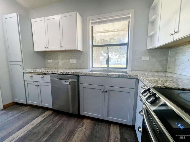 720 W 1st, Fairfield, ID 83327 - kitchen featuring appliances with stainless steel finishes, a sink, dark wood finished floors, and backsplash