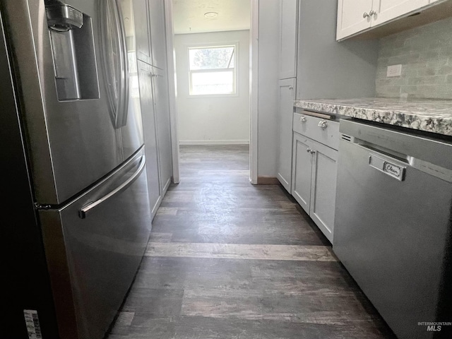 720 W 1st, Fairfield, ID 83327 - kitchen featuring stainless steel appliances, light countertops, tasteful backsplash, white cabinetry, and wood finished floors