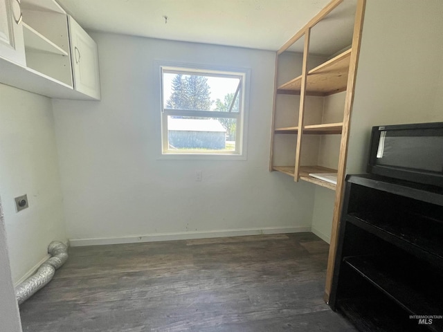 720 W 1st, Fairfield, ID 83327 - washroom featuring electric dryer hookup, dark wood-style floors, and baseboards
