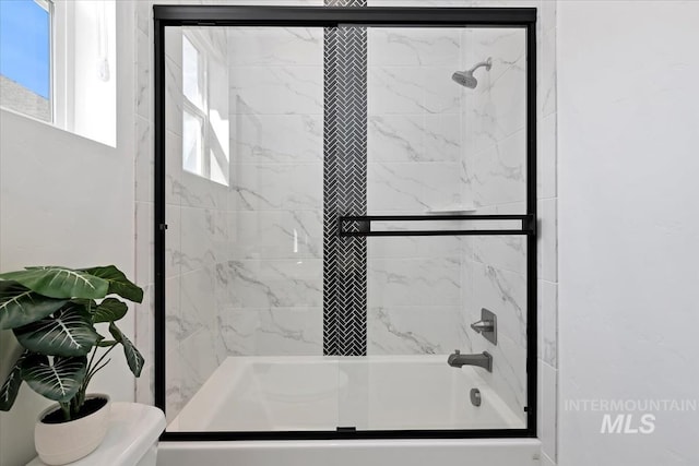 full bath with combined bath / shower with glass door