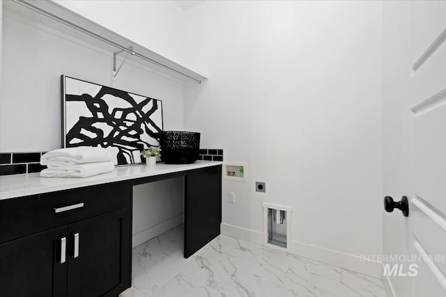 laundry room featuring electric dryer hookup, marble finish floor, washer hookup, baseboards, and cabinet space