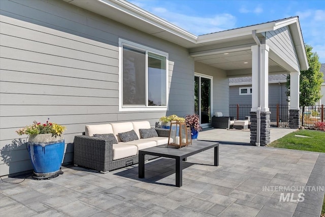 view of patio / terrace featuring fence and an outdoor hangout area