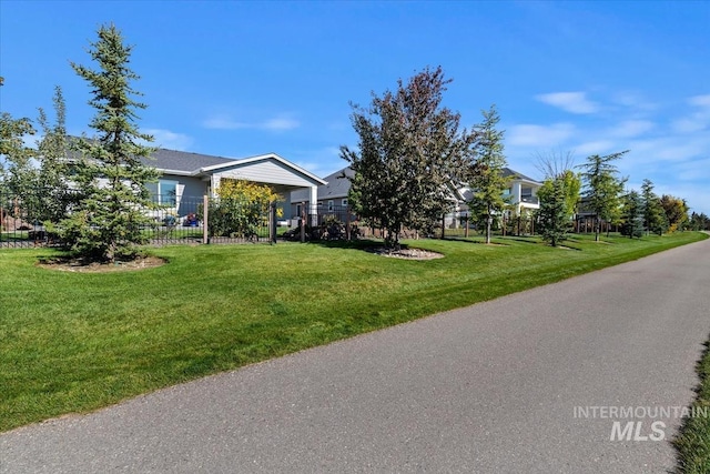 exterior space with a yard and fence