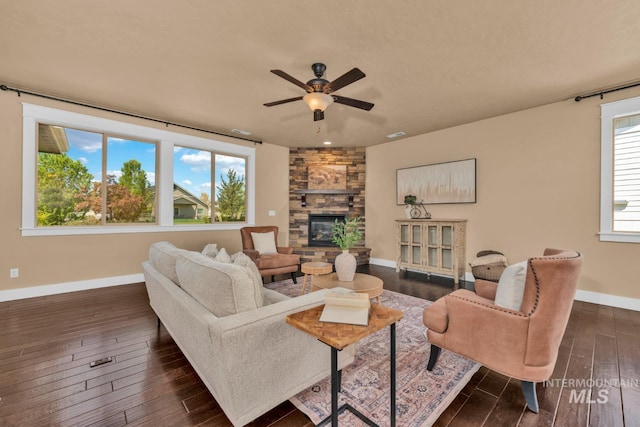 855 N Morley Green Pl, Eagle, ID 83616 - living room with ceiling fan, dark wood-style floors, baseboards, and a fireplace