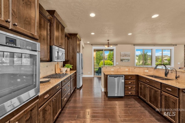 855 N Morley Green Pl, Eagle, ID 83616 - kitchen with recessed lighting, a sink, dark wood-style floors, and stainless steel appliances