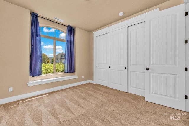 855 N Morley Green Pl, Eagle, ID 83616 - unfurnished bedroom with baseboards, visible vents, carpet, and a closet