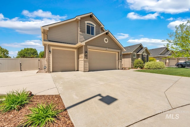 855 N Morley Green Pl, Eagle, ID 83616 - view of front of home featuring a garage, a gate, fence, and driveway