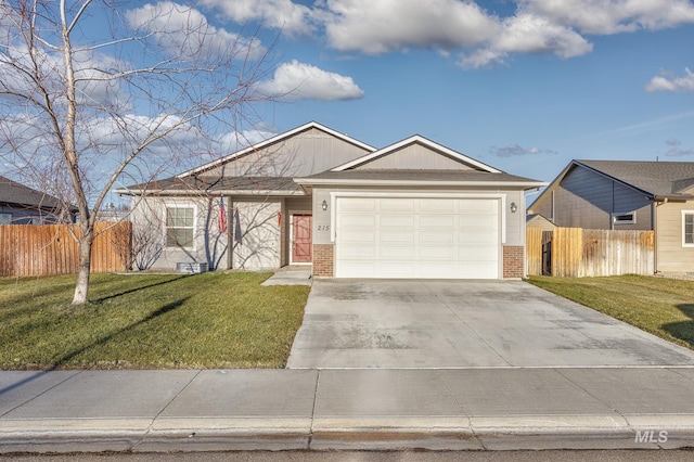 view of front of home featuring a front yard and a garage