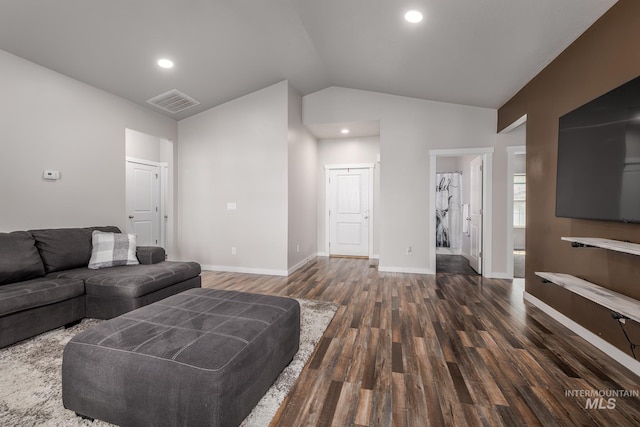 living room with lofted ceiling and dark wood-type flooring