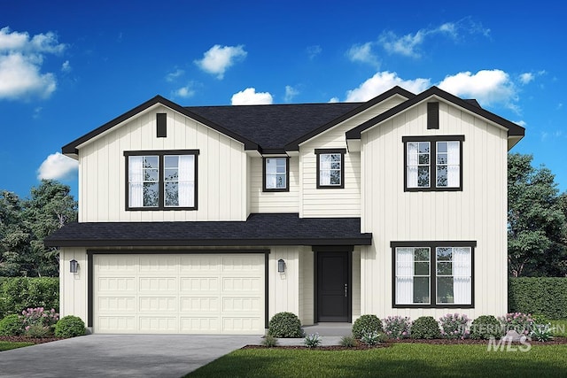 view of front of property featuring a front yard and a garage